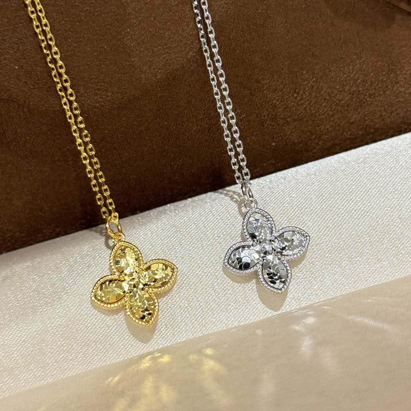 Van Cleef & Arpels Gold and Silver Flower Pendant Necklaces